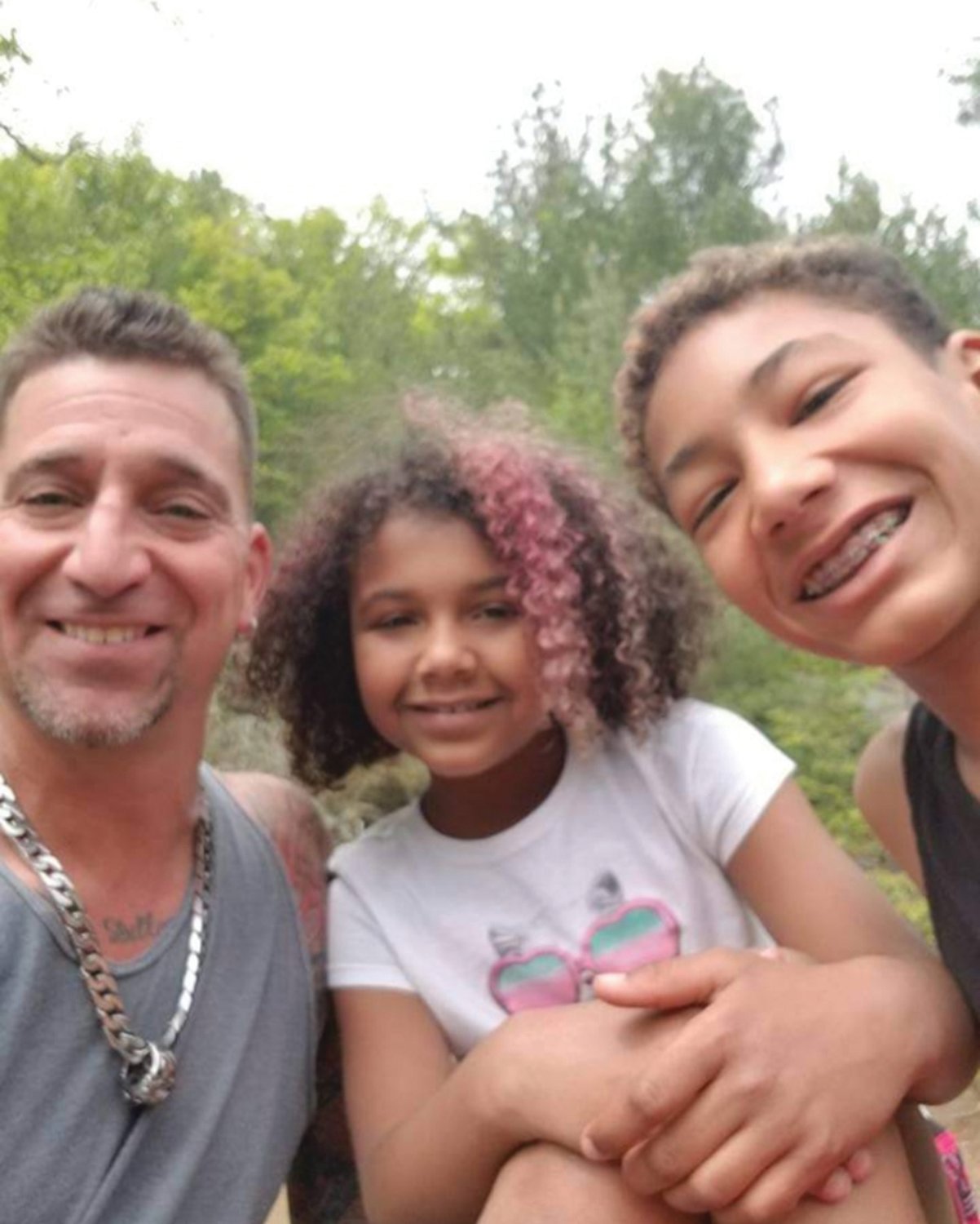 HAPPIER TIMES: David Viens poses for a photo with two of his kids — Racquell “Rocky” and Dillon Viens. Dillon died in February following a shooting in a Cedar Street home.